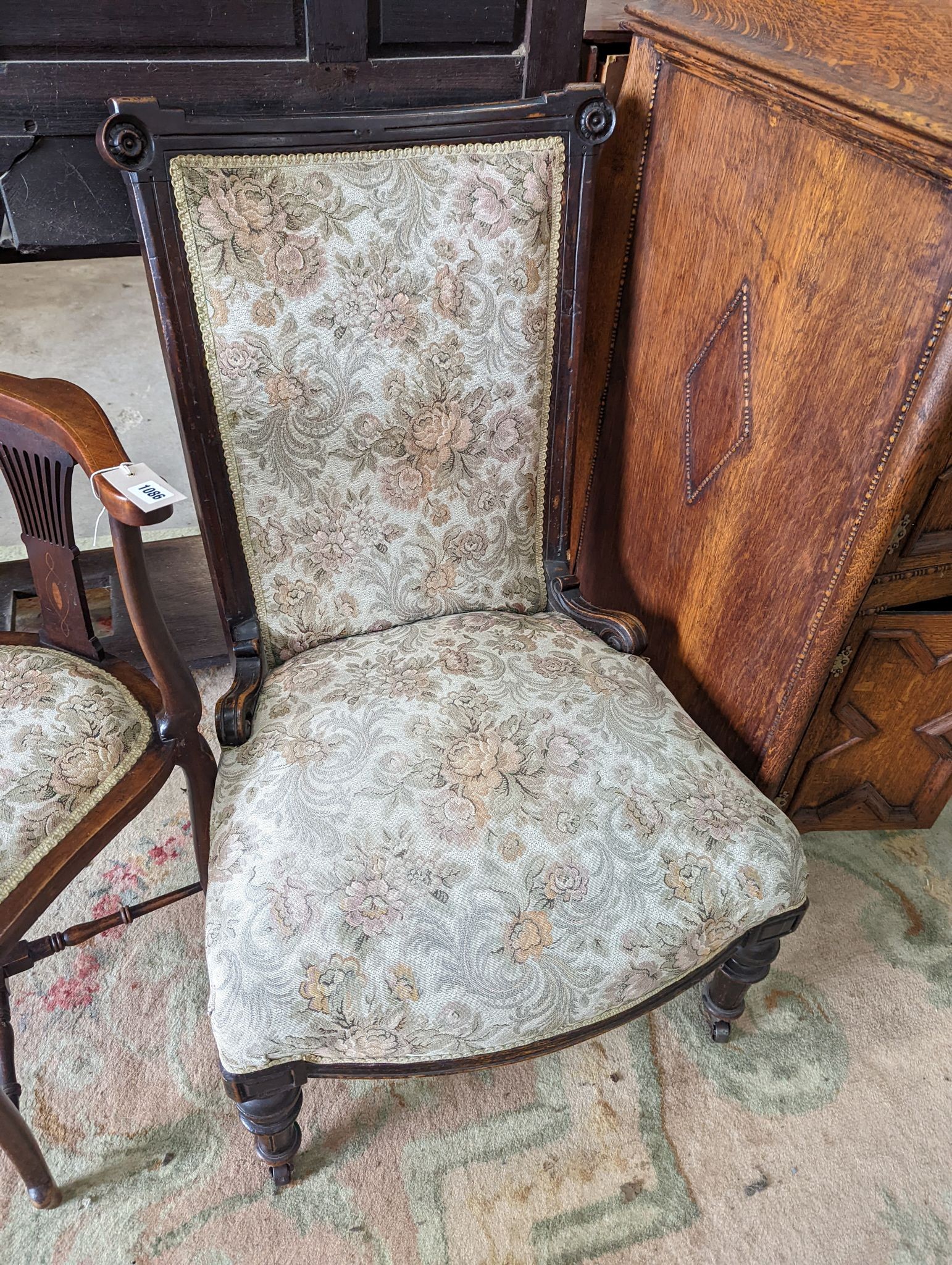A late Victorian upholstered nursing chair and an Edwardian inlaid mahogany corner elbow chair